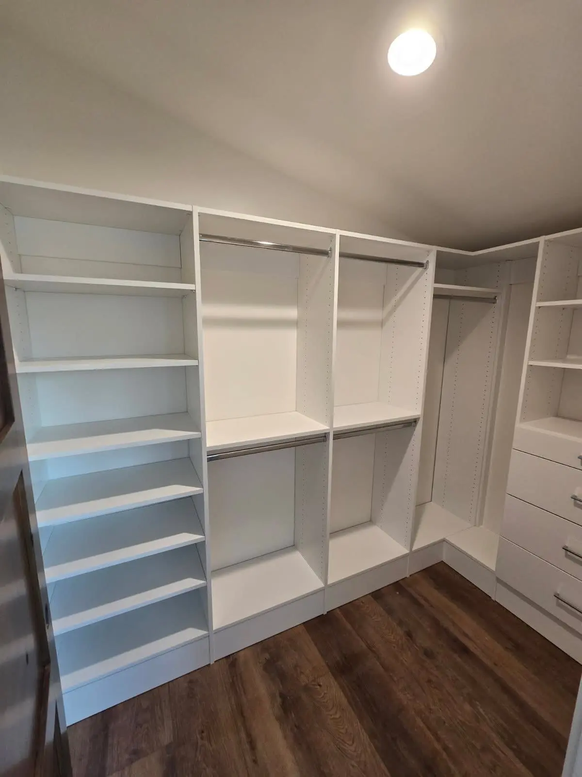 White corner closet shelving by DC Cabinets