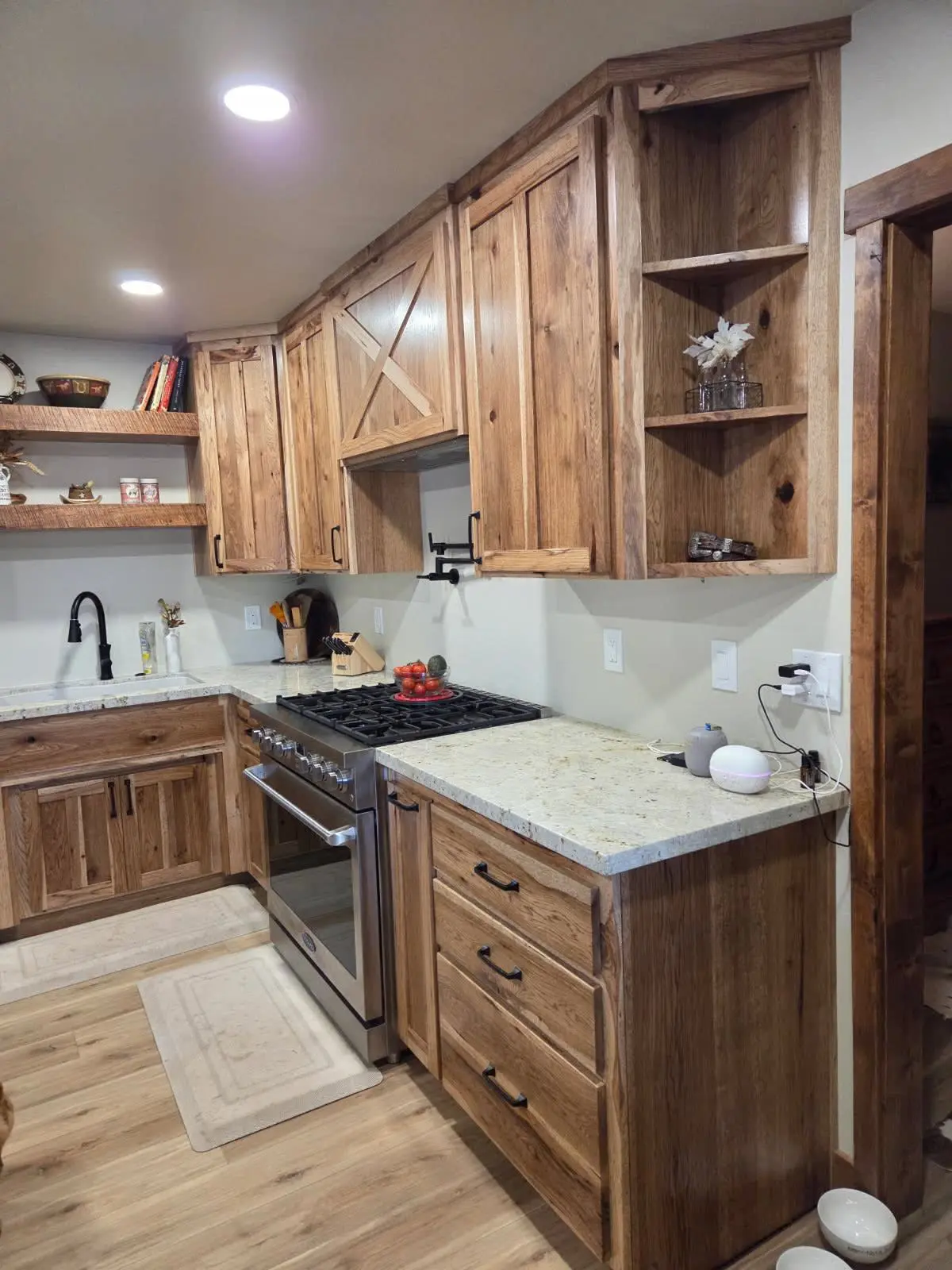 Rustic wood kitchen cabinets with corner shelving by DC Cabinets